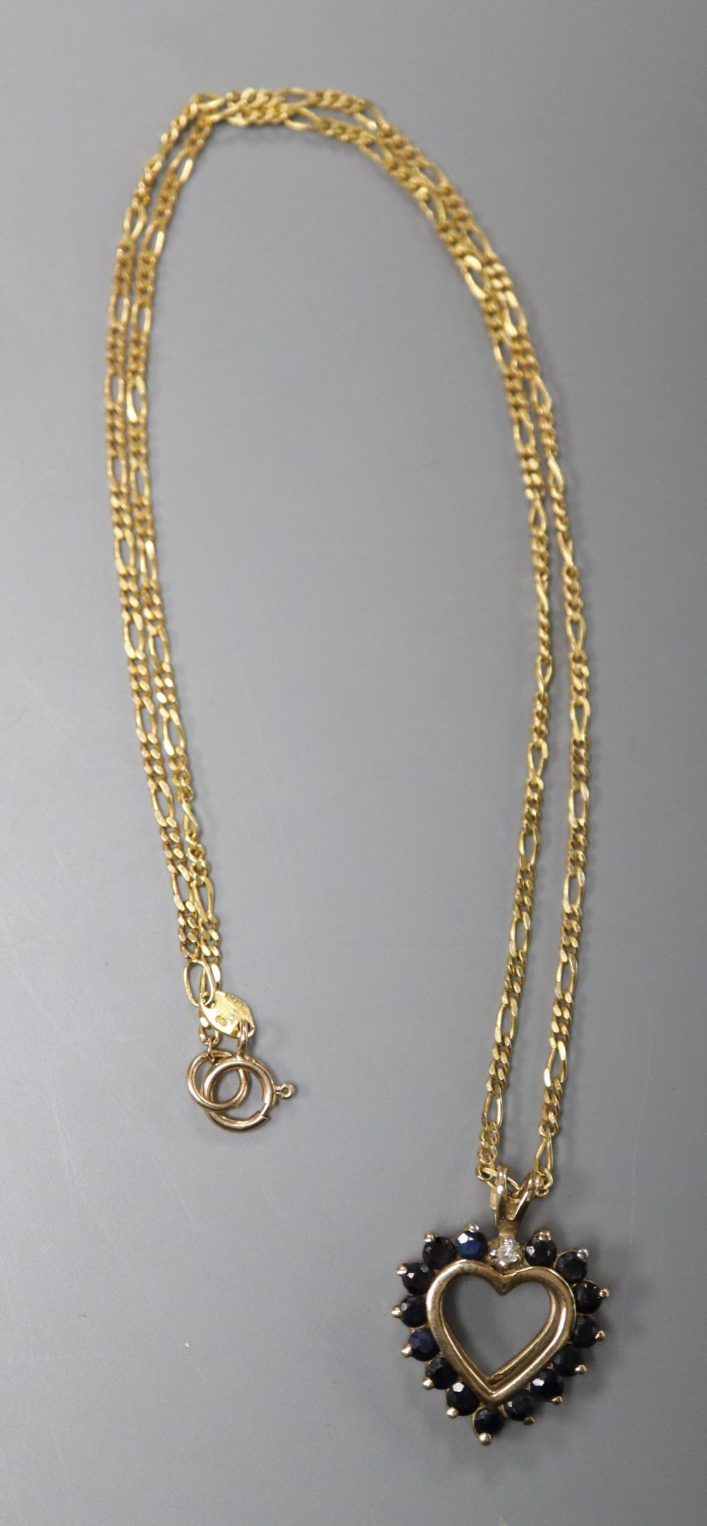 A 9ct gold, sapphire and diamond heart-shaped pendant on 9ct gold fine chain, pendant 22mm, gross 4.3 grams.